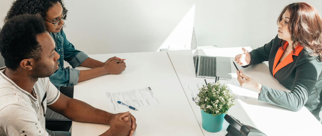 Banker talking to a couple about financials
